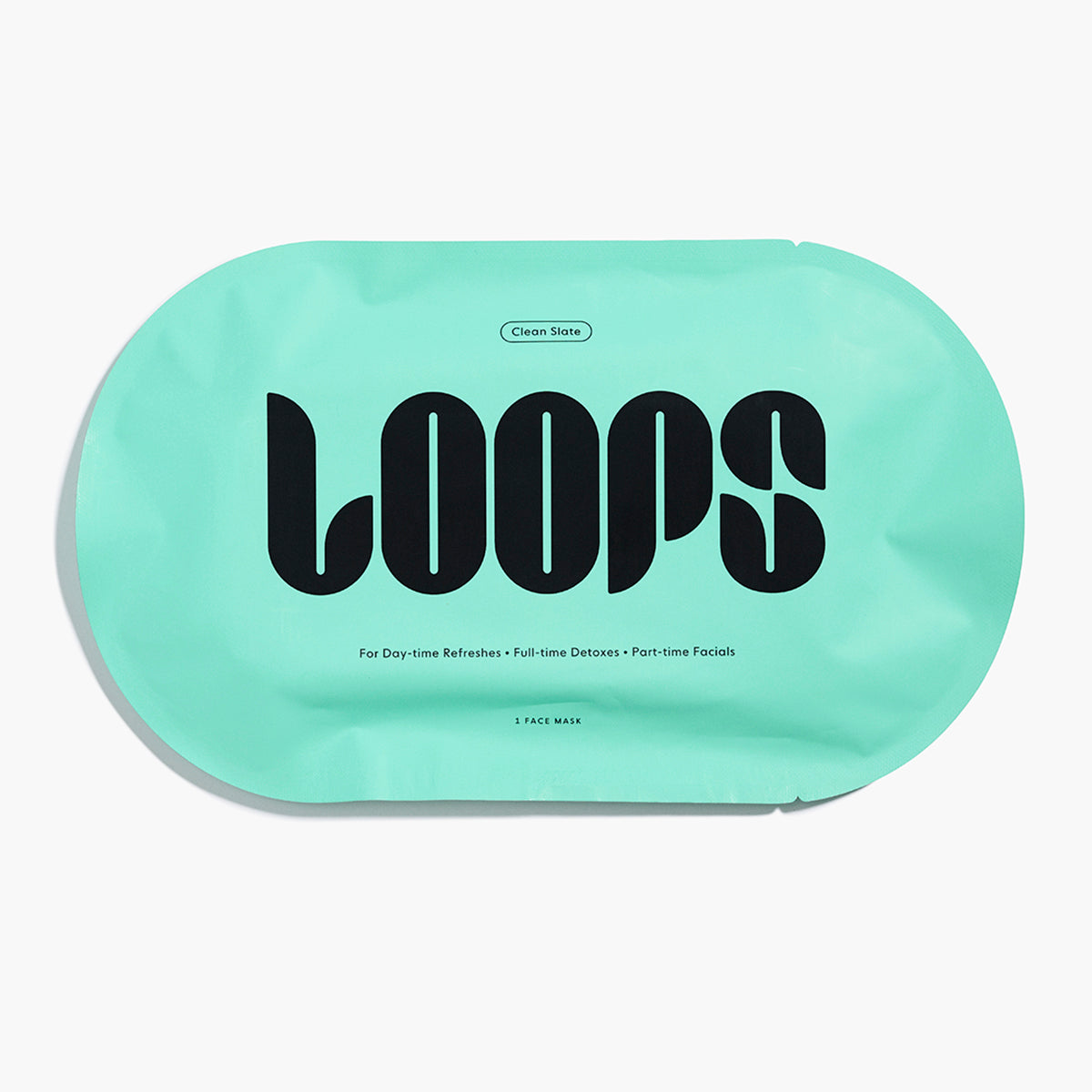 Oval shaped LOOPS Clean Slate face mask in light blue packaging.