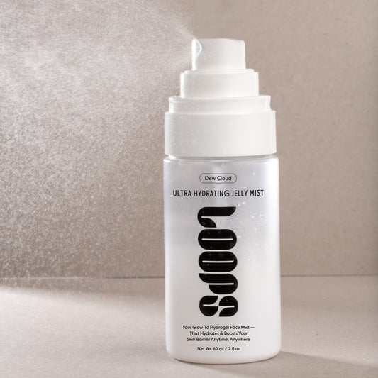 White bottle of Dew Cloud Ultra Hydrating Jelly Mist on a neutral background