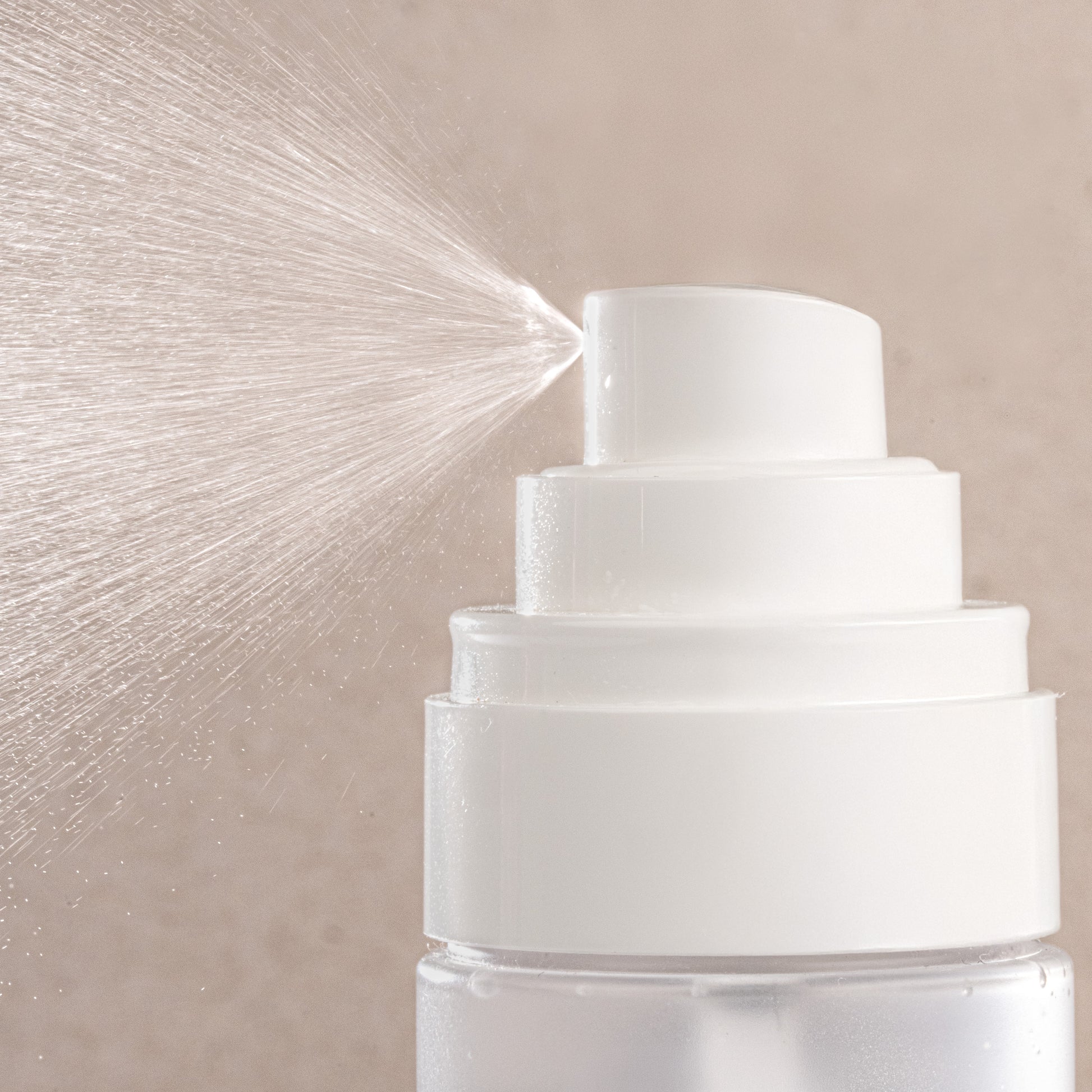 White top of dew cloud jelly mist with a beige textured background