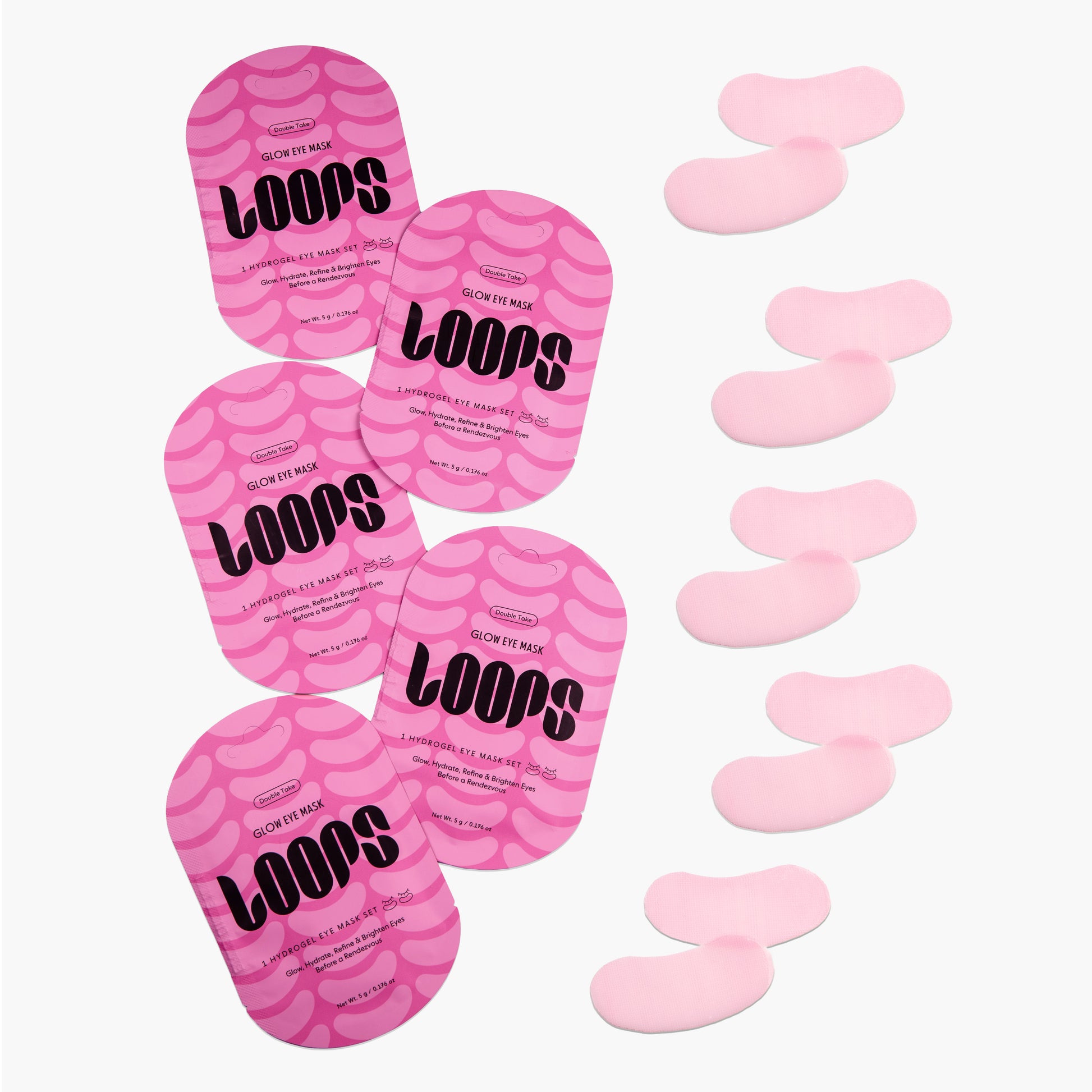 Pink eye masks labeled 'LOOPS' with some removed on a white background