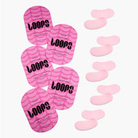 Pink eye masks labeled 'LOOPS' with some removed on a white background