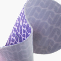 Close-up of textured purple mouth tape strip with a pattern