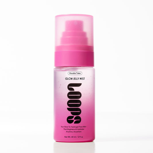 Pink bottle of 'Double Take Glow Jelly Mist' on a white background