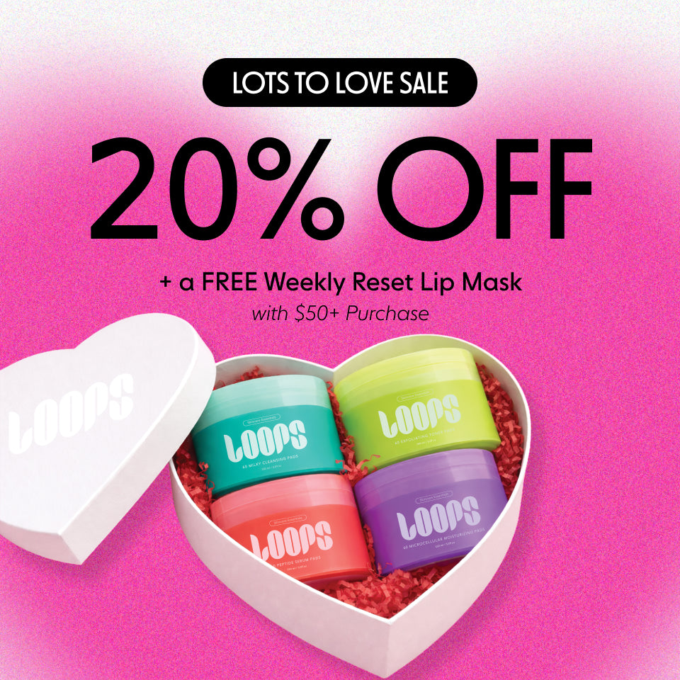 Navigate to Heart-shaped box with colorful masks and promotional text on a pink background