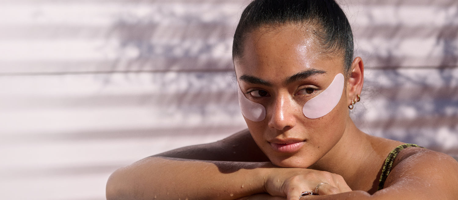 Woman with LOOPS Double Take Eye Mask on her face against a neutral background