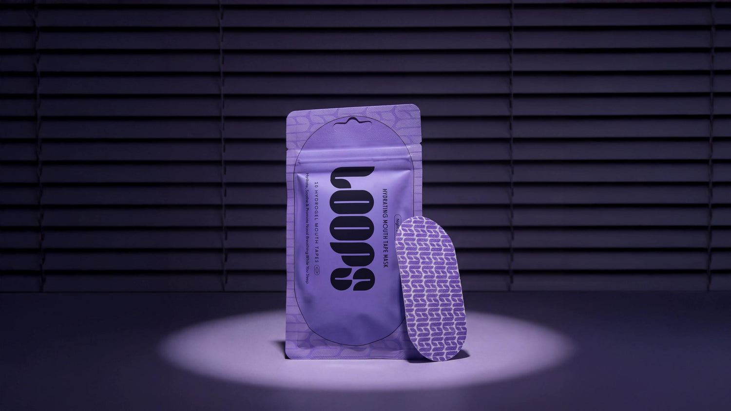 Purple packaging with 'LOOPS' branding on a dark background
