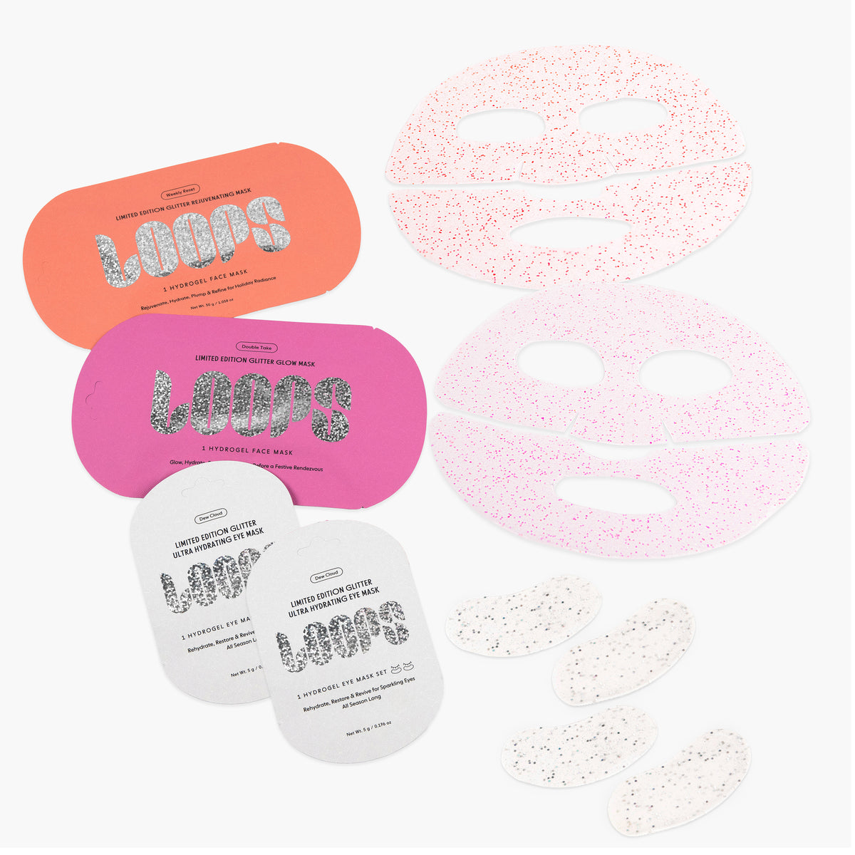 Laydown on white background of 2 glitter face masks and 4 glitter eye masks with product packaging