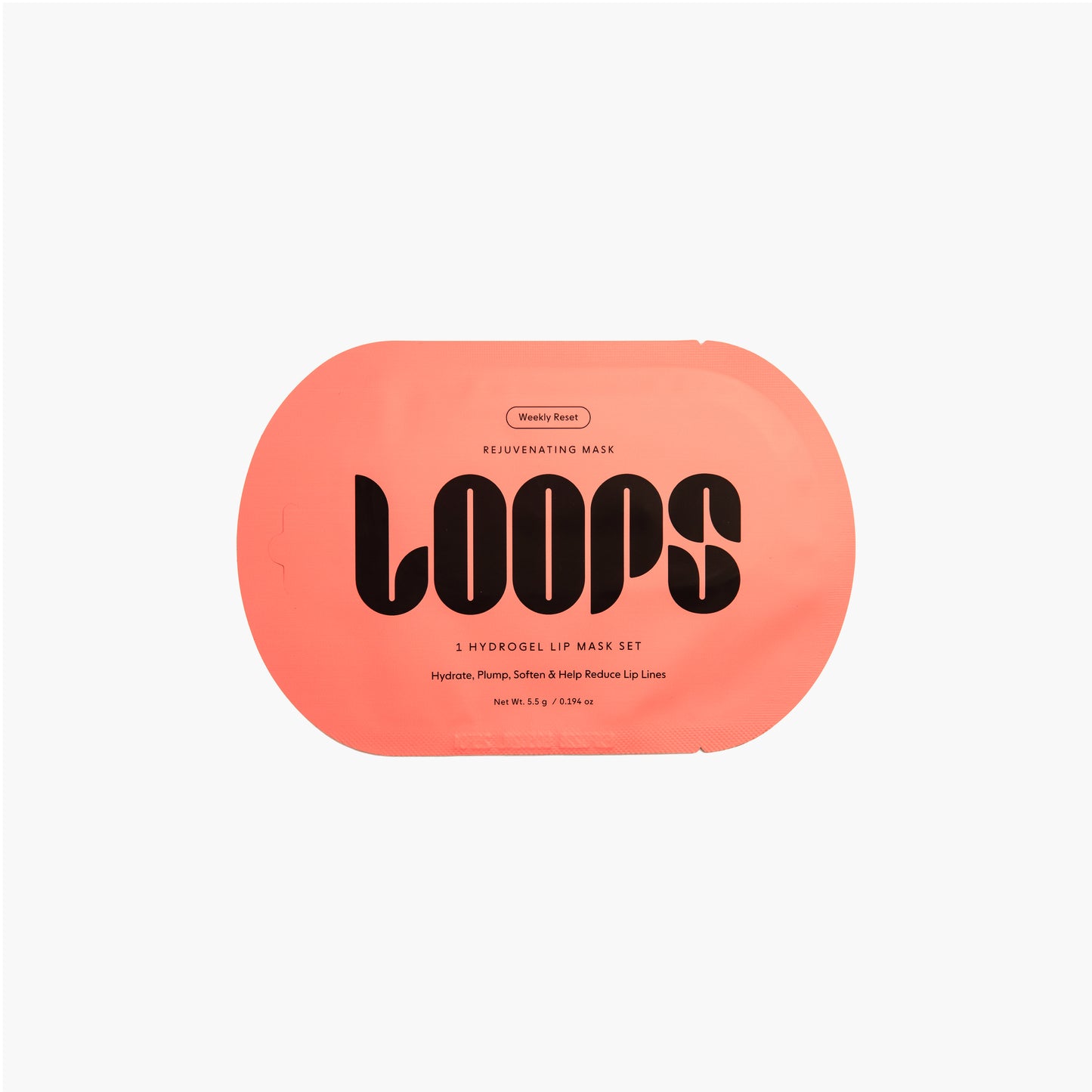 Oval shaped LOOPS Weekly Reset Lip Mask in orange packaging.