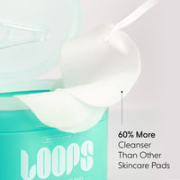 Skincare pads with a container labeled 'LOOPS' on a light background