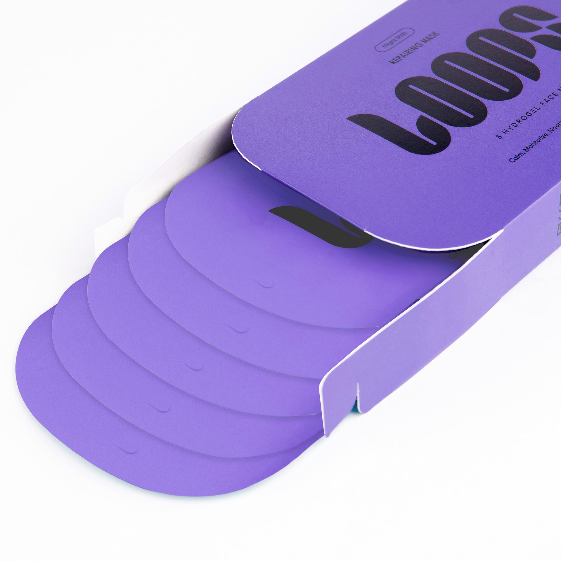 Purple masks partially pulled from a matching purple cardboard box with black printed LOOPS branding on a white background.