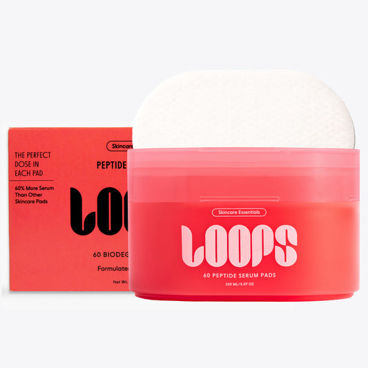 Red container of Loops skincare pads with white lid on a white background