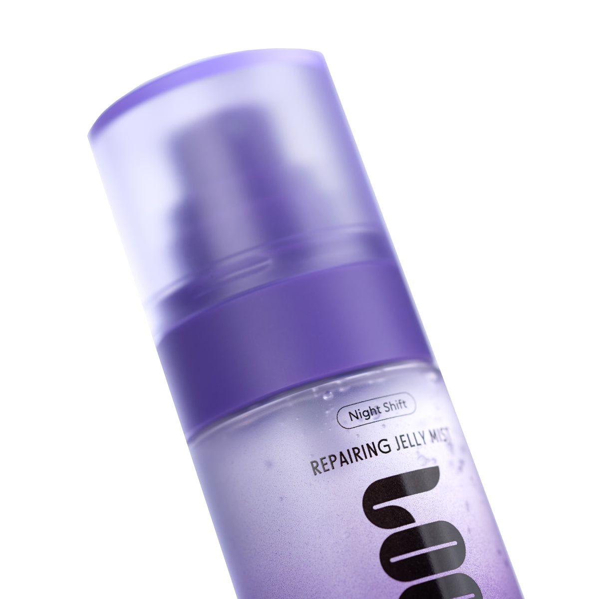 A close-up of a purple cosmetic pump bottle labeled 'Night Shift Repairing Jelly Mist' on a clean white background.