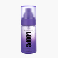 A bottle of 'loops' Repairing Jelly Mist by 'Nights Shift' on a clean white background. The bottle is a frosted light purple with a darker purple pump collar and a translucent purple cap.