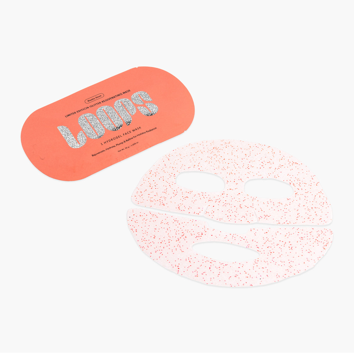 A sheet mask featuring glitter face mask, shown next to coral orange packaging card with the brand name 'LOOPS' in glittery silver lettering.