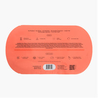 The back of a peach-colored sheet mask, featuring detailed product information, ingredients, application instructions, a barcode, and a QR code on a solid white background.